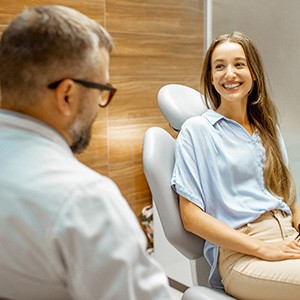 Lady smiles at dentist