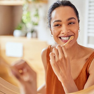 Woman eating healthy meal at home